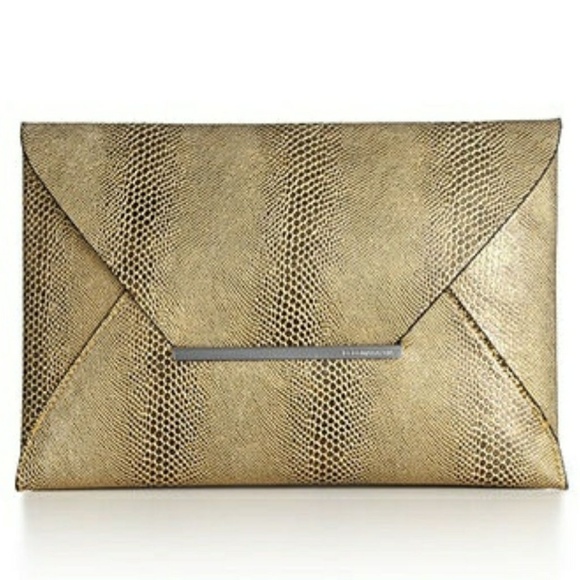 BCBGMaxAzria Handbags - BCBGMaxAzria Gold Snake Embossed Clutch